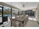 Inviting screened porch with a dining table and a view of the backyard pool at 4711 Placid Cir, Sarasota, FL 34231