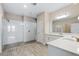 Bathroom features double sinks with granite countertops, a glass enclosed shower, and modern fixtures at 4829 Antrim Dr, Sarasota, FL 34240