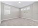 Bedroom featuring neutral walls, carpet floor, window shutters and wall decor, creating a calming atmosphere at 4829 Antrim Dr, Sarasota, FL 34240