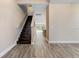 Foyer view of stairs and hallway leading to kitchen area at 4829 Antrim Dr, Sarasota, FL 34240