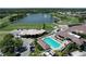 Aerial view of amenities including a pool, golf course, and lake at the Heritage Oaks Golf and Country Club at 5211 Mahogany Run # 113, Sarasota, FL 34241