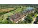 Beautiful aerial view of a condo community, golf course and lake at 5211 Mahogany Run # 113, Sarasota, FL 34241