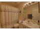 Full bathroom with a shower and tub combination and white vanity at 5211 Mahogany Run # 113, Sarasota, FL 34241
