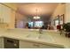 View from kitchen over breakfast bar overlooking the dining and living room at 5211 Mahogany Run # 113, Sarasota, FL 34241