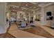 Beautifully decorated lobby with cozy seating area, fireplace, and elegant decor at 5211 Mahogany Run # 113, Sarasota, FL 34241