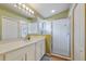 Bathroom featuring a vanity with a framed mirror, and a glass-enclosed shower with tiled floors at 5227 Lansdowne Way, Palmetto, FL 34221