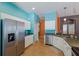 Spacious kitchen with stainless steel appliances, white cabinets, and ample counter space for food preparation at 5227 Lansdowne Way, Palmetto, FL 34221