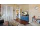 Inviting living room with hardwood floors, a blue accent dresser, and bright light throughout at 5227 Lansdowne Way, Palmetto, FL 34221