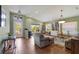 Bright and airy living room featuring tile floors, a large window with backyard views, and a cozy seating area at 5227 Lansdowne Way, Palmetto, FL 34221