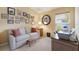 Comfortable office with sofa, desk, and decor; bright natural light from the window at 5227 Lansdowne Way, Palmetto, FL 34221