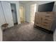 Well-organized bedroom with a TV on a chest of drawers, neutral decor, and ensuite access at 5262 Asher Ct, Sarasota, FL 34232
