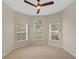Bright bedroom with a ceiling fan, large windows with great outdoor views and natural light at 5412 72Nd E Ter, Ellenton, FL 34222