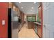 Well-lit kitchen features stainless steel appliances, wooden cabinets, and a large window overlooking the backyard at 5412 72Nd E Ter, Ellenton, FL 34222