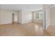 Spacious living room features neutral paint, tile floors, and a door to another room at 5412 72Nd E Ter, Ellenton, FL 34222