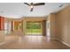 Spacious living room with tiled floors and sliding glass doors leading to a backyard view at 5412 72Nd E Ter, Ellenton, FL 34222