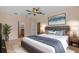 Stylishly furnished main bedroom with a plush bed, coordinated décor, and a tranquil ambiance at 5412 72Nd E Ter, Ellenton, FL 34222