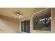 Covered patio featuring ceiling fan and sliding glass doors overlooking the serene backyard at 5412 72Nd E Ter, Ellenton, FL 34222