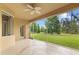 Screened porch with tiled floor and a view of a lush green yard at 5412 72Nd E Ter, Ellenton, FL 34222
