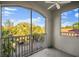 Breezy screened in balcony with ample sunlight and views of palm trees and neighborhood at 5450 Bentgrass Dr # 5-301, Sarasota, FL 34235