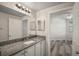 Bathroom with granite countertop vanity, mirror, and modern lighting at 5450 Bentgrass Dr # 5-301, Sarasota, FL 34235