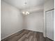 A bright, neutral dining area featuring stylish light fixture and ample closet space at 5450 Bentgrass Dr # 5-301, Sarasota, FL 34235