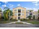 Inviting condo building with lush landscaping and a well-maintained exterior at 5450 Bentgrass Dr # 5-301, Sarasota, FL 34235