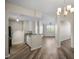 Open concept kitchen with modern countertops that flows to the living space at 5450 Bentgrass Dr # 5-301, Sarasota, FL 34235