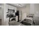 Updated kitchen with stainless appliances, granite counters, and modern lighting fixtures at 5450 Bentgrass Dr # 5-301, Sarasota, FL 34235