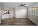 Inviting living area with wood flooring, connecting seamlessly to a modern kitchen at 5450 Bentgrass Dr # 5-301, Sarasota, FL 34235