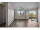 Open concept living room with a ceiling fan and access to a balcony, light and airy at 5450 Bentgrass Dr # 5-301, Sarasota, FL 34235