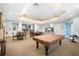 Bright recreation room with a pool table, dining tables, a kitchenette, and comfortable seating at 5450 Bentgrass Dr # 5-301, Sarasota, FL 34235