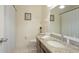 Clean bathroom featuring a granite countertop, vanity mirror, and tiled floors at 5562 Hayden Blvd, Sarasota, FL 34232