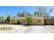 Charming single-story home with a well-maintained yard and a concrete driveway at 5562 Hayden Blvd, Sarasota, FL 34232