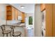 Charming kitchen with granite counter, breakfast bar, and direct access to outdoor patio at 5562 Hayden Blvd, Sarasota, FL 34232