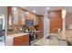 Modern kitchen featuring granite countertops, stainless steel appliances, and ample cabinet space at 5562 Hayden Blvd, Sarasota, FL 34232