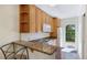 Charming kitchen with granite counter, breakfast bar, and direct access to outdoor patio at 5562 Hayden Blvd, Sarasota, FL 34232