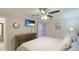 Comfortable main bedroom featuring a flat-screen television and neutral decor at 5562 Hayden Blvd, Sarasota, FL 34232