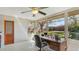 Bright sun room with a multitude of windows, tile floors, and backyard views at 5562 Hayden Blvd, Sarasota, FL 34232