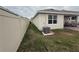 Side view of backyard featuring privacy fence, and patio at 5838 Elegant Orchid Way, Sarasota, FL 34232