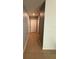 Hallway with neutral paint and flooring connecting various rooms in the home at 5838 Elegant Orchid Way, Sarasota, FL 34232