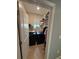 Bright laundry room features washer and dryer, a window, and storage shelves at 5838 Elegant Orchid Way, Sarasota, FL 34232