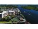 Expansive aerial view showcasing waterfront condos, boat docks, and beautiful waterfront scenery at 5855 Midnight Pass Rd # 303, Sarasota, FL 34242