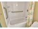 Well-lit bathroom with updated fixtures and a floral shower curtain at 5855 Midnight Pass Rd # 303, Sarasota, FL 34242