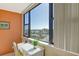 Bright and sunny bedroom with a cozy desk area overlooking the water at 5855 Midnight Pass Rd # 303, Sarasota, FL 34242