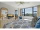Sun-filled bedroom features a large window showcasing panoramic views at 5855 Midnight Pass Rd # 303, Sarasota, FL 34242