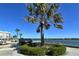 Dock view with greenery and American flag at 5855 Midnight Pass Rd # 303, Sarasota, FL 34242