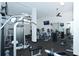 Well-equipped fitness center with modern weight machines, treadmills, and mirrored walls at 5855 Midnight Pass Rd # 303, Sarasota, FL 34242