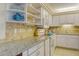 Well-equipped kitchen with ample counter space, modern appliances, and stylish finishes, ideal for cooking and entertaining at 5855 Midnight Pass Rd # 303, Sarasota, FL 34242
