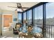 Serene screened lanai with a table for four offering gorgeous views of the surrounding nature at 5855 Midnight Pass Rd # 303, Sarasota, FL 34242
