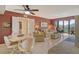 Open floor plan combines living, dining areas and balcony access for seamless entertaining at 5855 Midnight Pass Rd # 303, Sarasota, FL 34242
